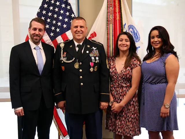 This picture seems to be clicked inside the hall. In the center we can see the two women wearing...